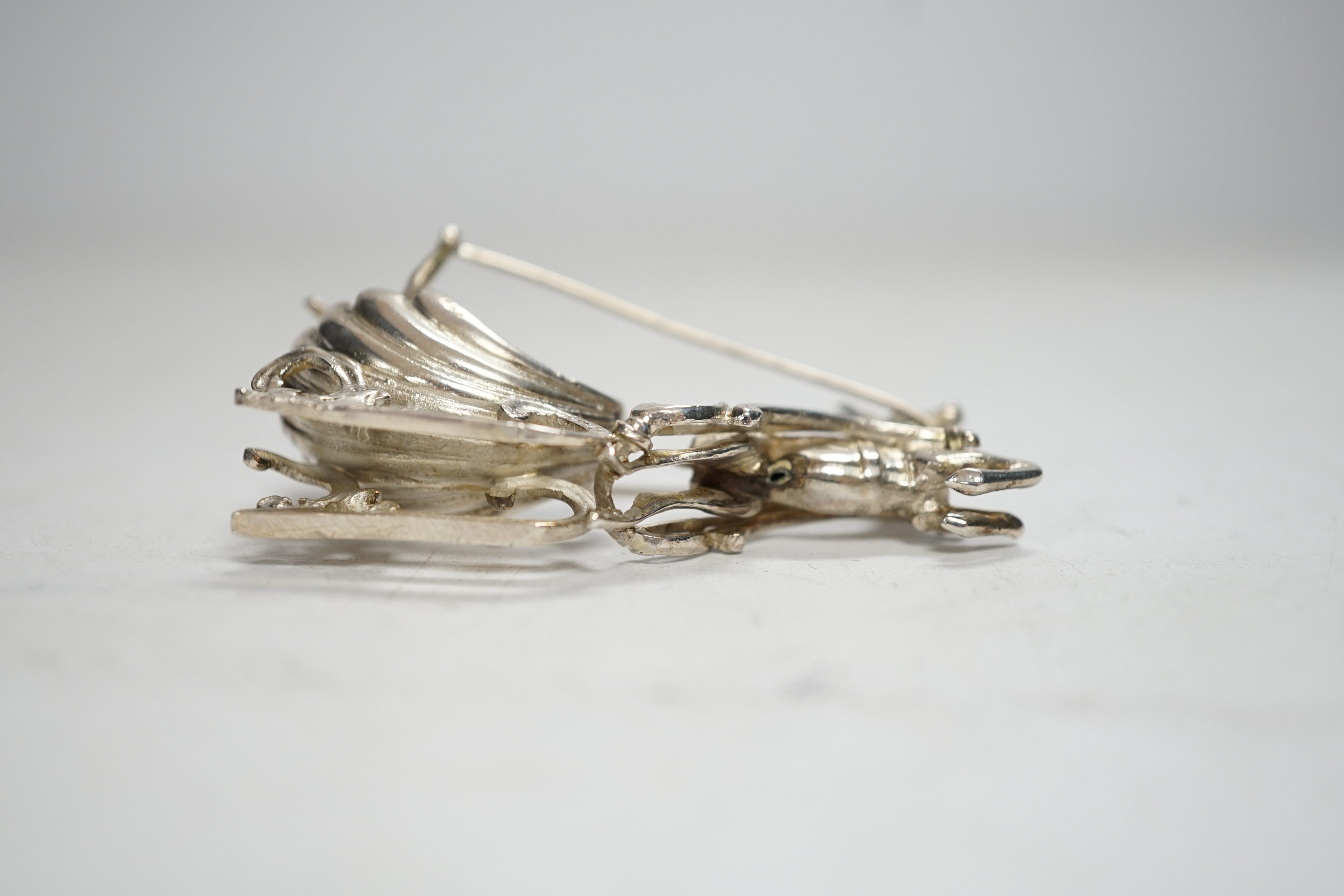 A late 19th century Hanau miniature silver model of a deer pulling a sleigh with cherub, by Berthold Muller, import marks for Chester, 1899, length 64mm.